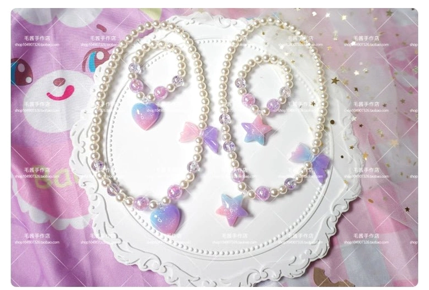 Two sets pastel purple star heart gradient pearl choker and bracelet lolita jewelry on lace tray