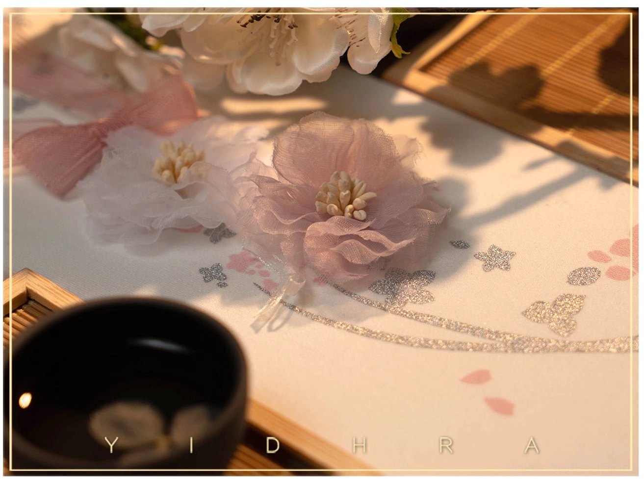 Qi lolita pantyhose fabric flat lay sample sheer material with silver glitter butterfly patterns and pink fabric flower pom-pom decorations