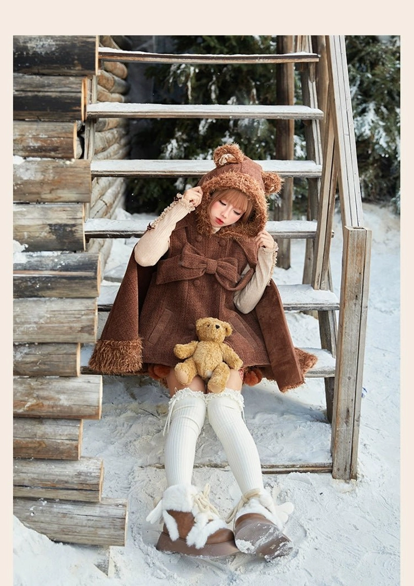 Rabbit ear hooded lolita cape displaying functional side pocket placement, plush edge detailing and overall silhouette drape on model in motion