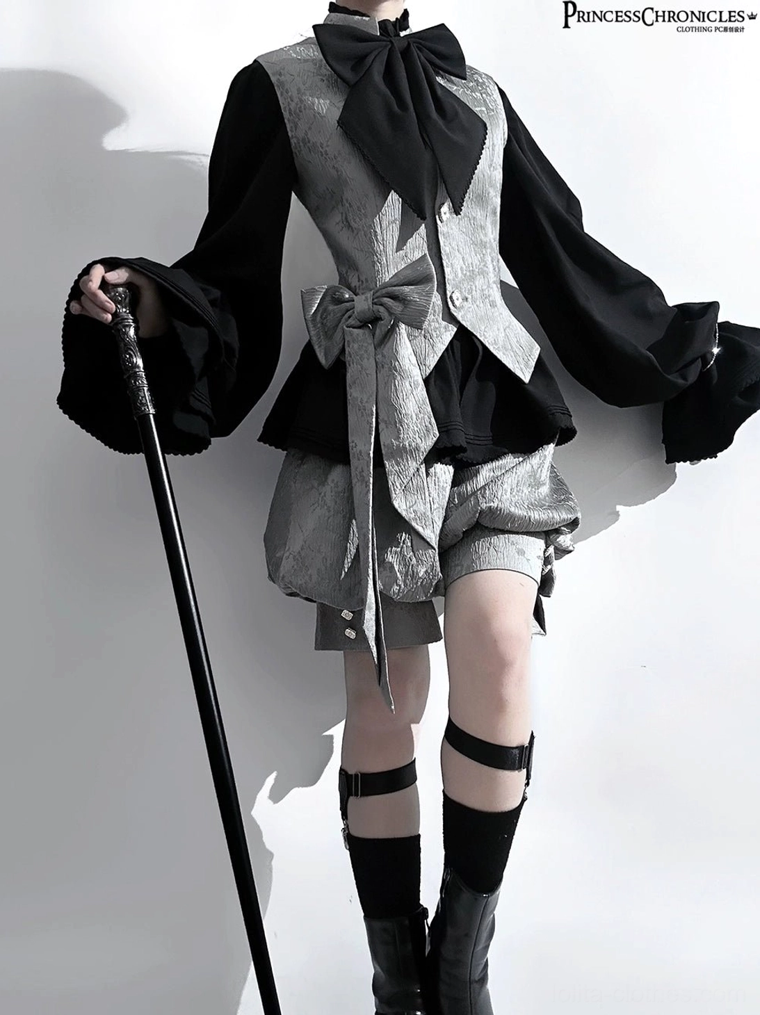 Rabbit ear ouji lolita suit three-quarter left pose black sleeve accents leg strap boots classic silhouette with cane