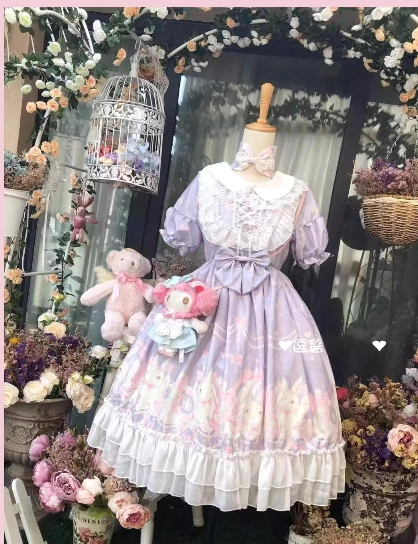Short-sleeve pastel purple rabbit print Lolita OP dress with puffed sleeves featuring refined lace trim, heart-shaped waist bow, floral print details, complete sweet Lolita outfit coordination