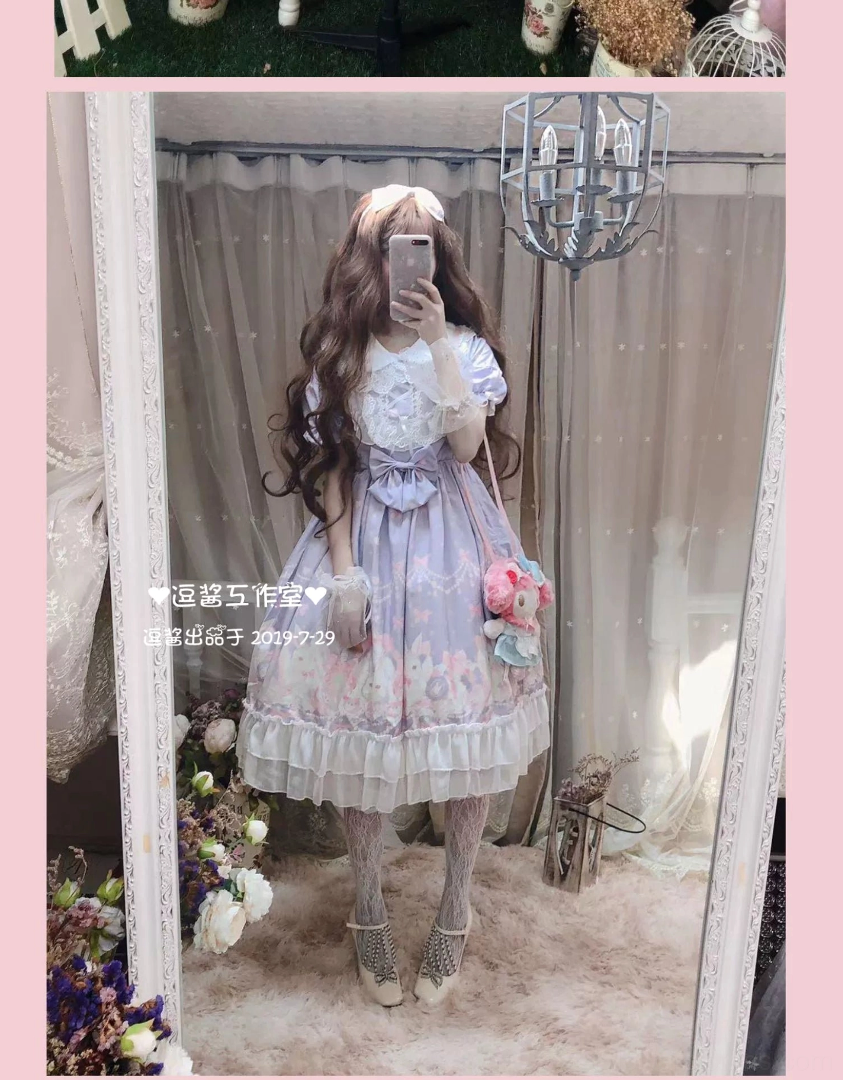 Short-sleeve version of rabbit print Lolita OP dress with puffed sleeves featuring refined lace trim, heart-shaped waist bow, floral side print details, mirror selfie full front view