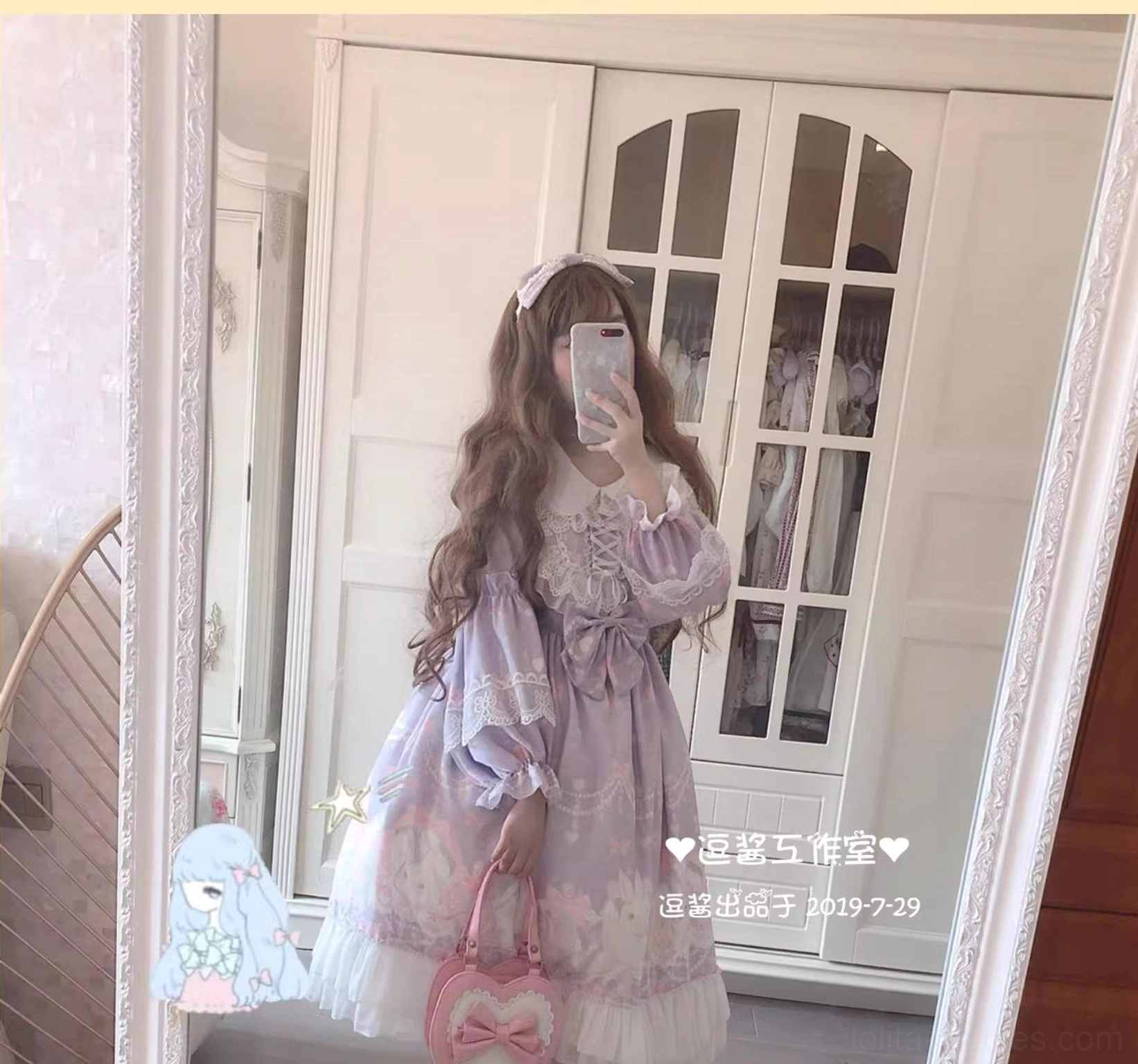 Close-up mirror selfie front view of pastel purple rabbit print Lolita one-piece dress featuring delicate lace neckline, model holding pink heart handbag, sweet Lolita coordinate