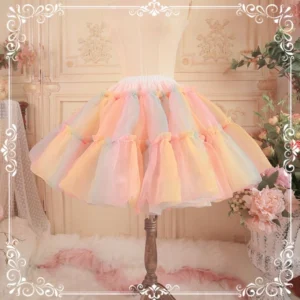 Rainbow gradient lolita petticoat with pastel tulle layers displayed on vintage dress form, showing full voluminous silhouette and multicolor ombre effect