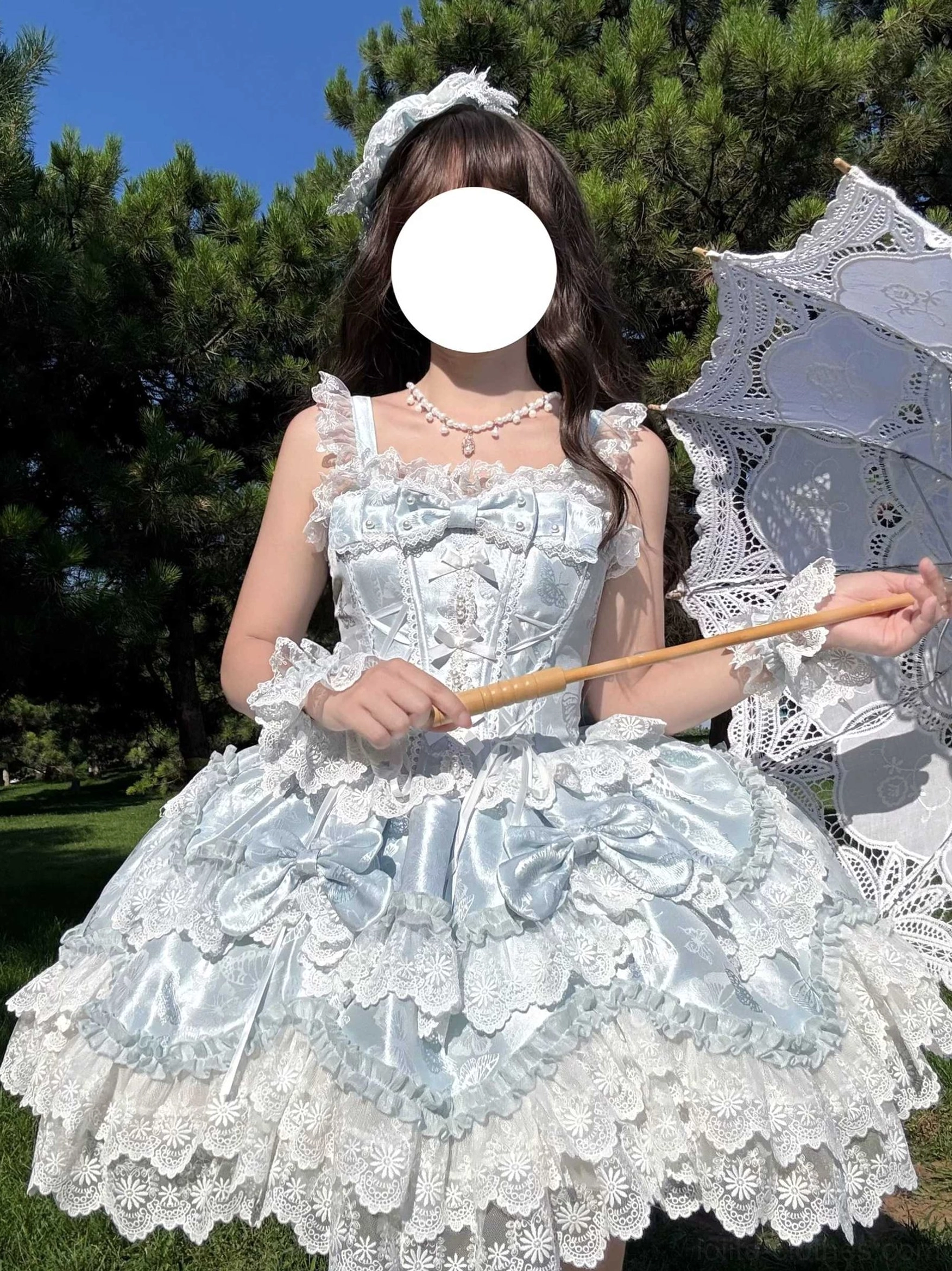 Realm of Sea Moon sweet lolita JSK front medium view model outdoor pine tree grassland sky blue satin fabric lace trims big bows pearl necklace lace parasol