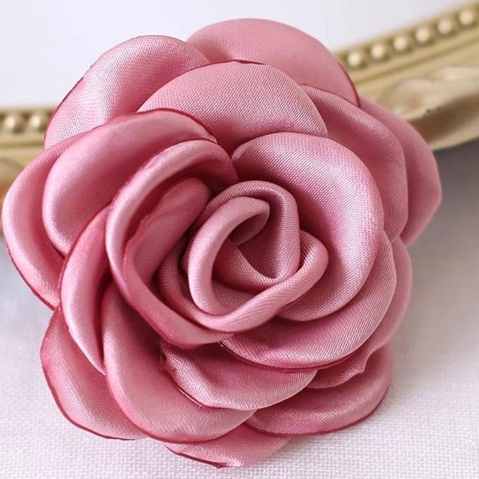 Red bean color fabric rose hair clip Lolita accessory standalone product view highlighting unique muted warm tone and satin finish