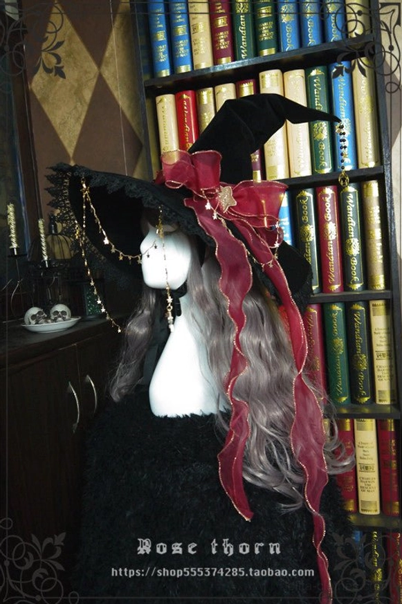 Red satin bow decorated lolita halloween witch hat with black velvet base and delicate lace brim trim, front three-quarter view