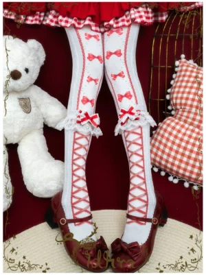 Red festive bow lolita pantyhose with white ruffled lace calf trim and cross-strap pattern paired with red mary jane shoes and red lolita skirt holiday styling