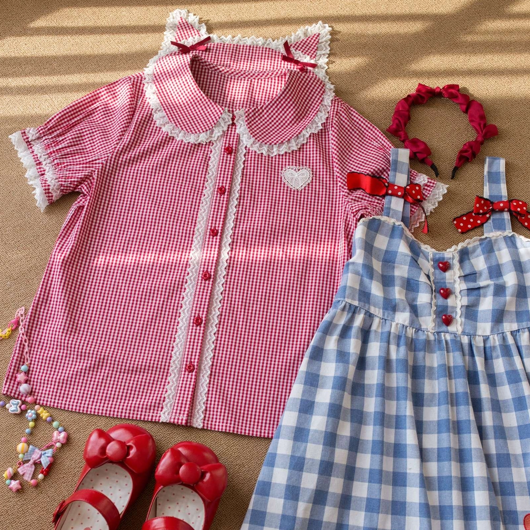 Red gingham plaid Lolita blouse with cat ear collar red bows and lace trim, paired with blue gingham jumperskirt and red bow hair accessories