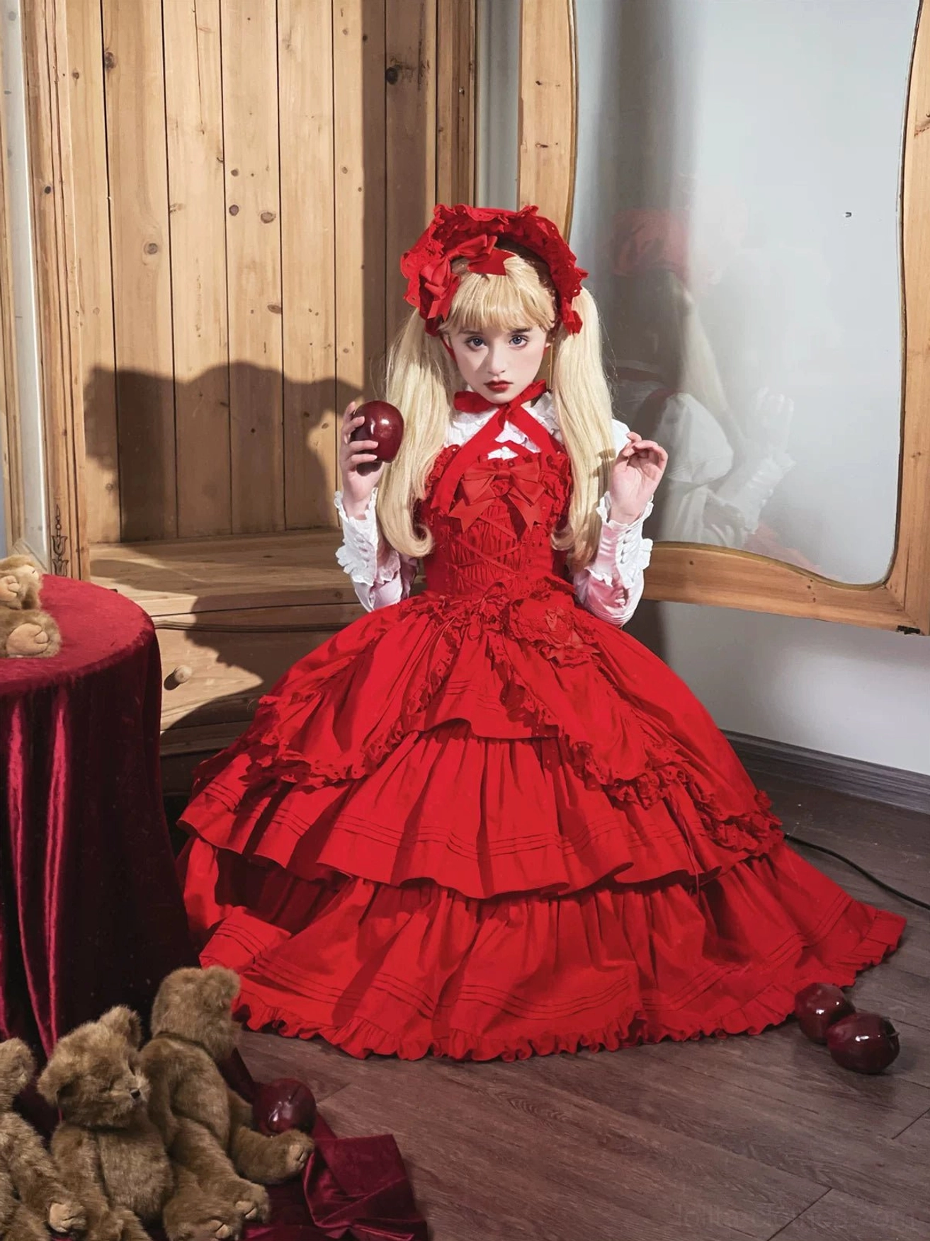 Back full-body mannequin shot of red Gothic Lolita JSK with large detachable back bow, adjustable shoulder straps, and ruffled layered hem