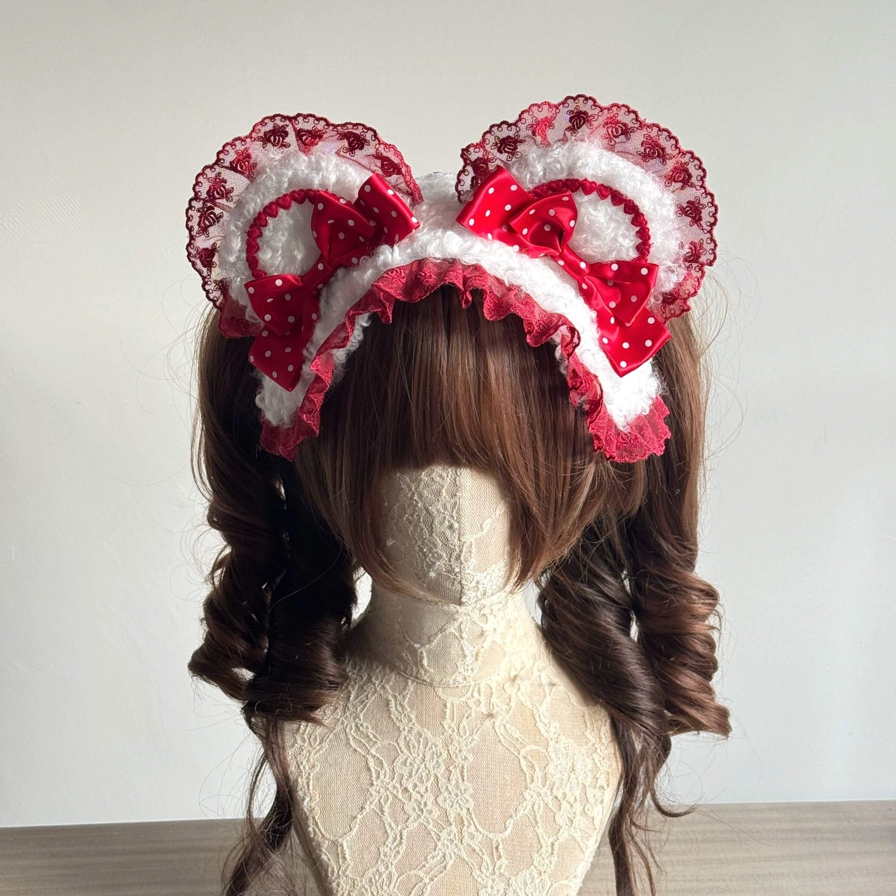 Red lolita bear ear headband with red polka dot satin bows white ruffled lace trim close-up front view