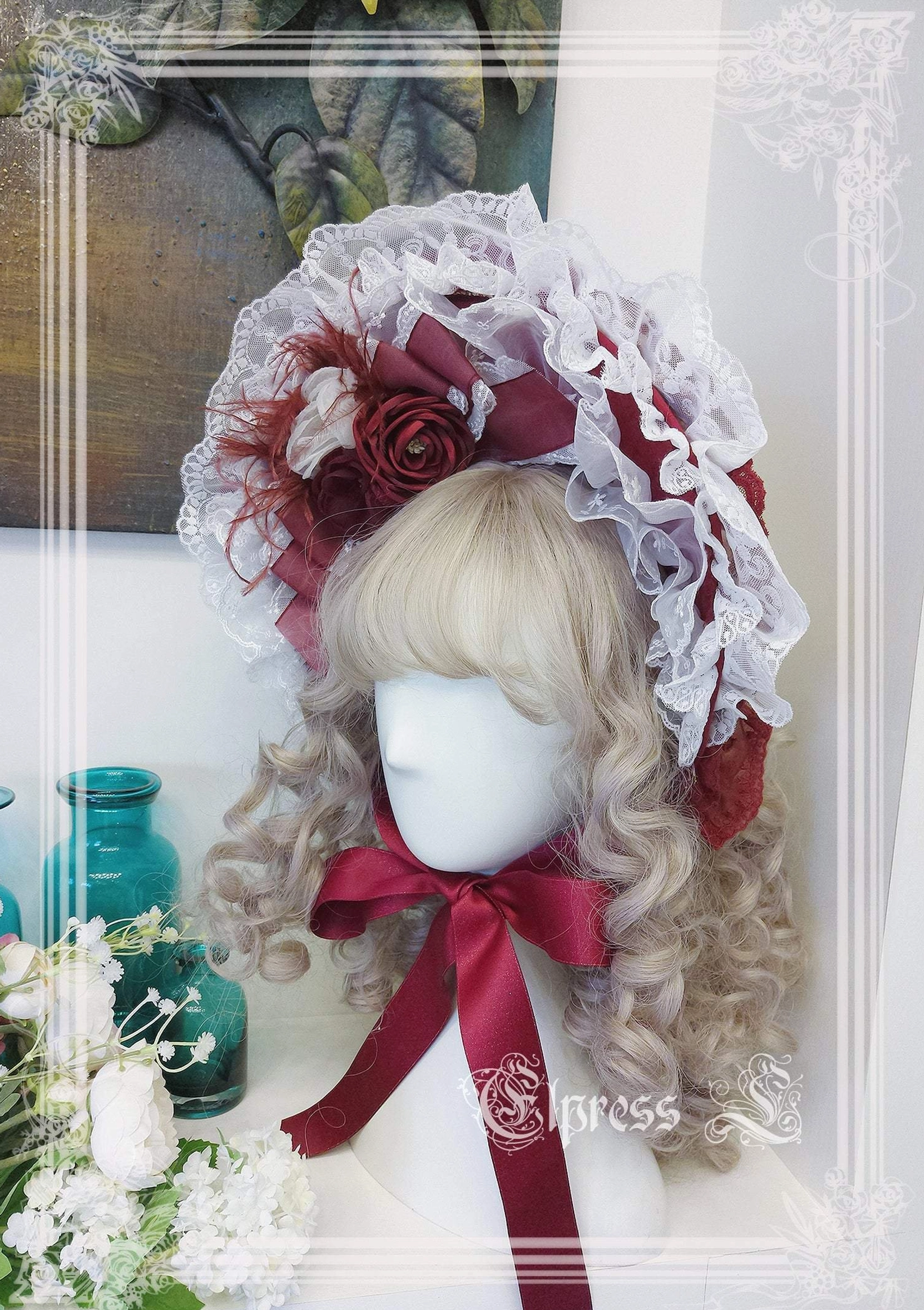 Red lolita bonnet BNT full piece with artificial flowers lace flounce and cascading ribbon ties front view complete headpiece