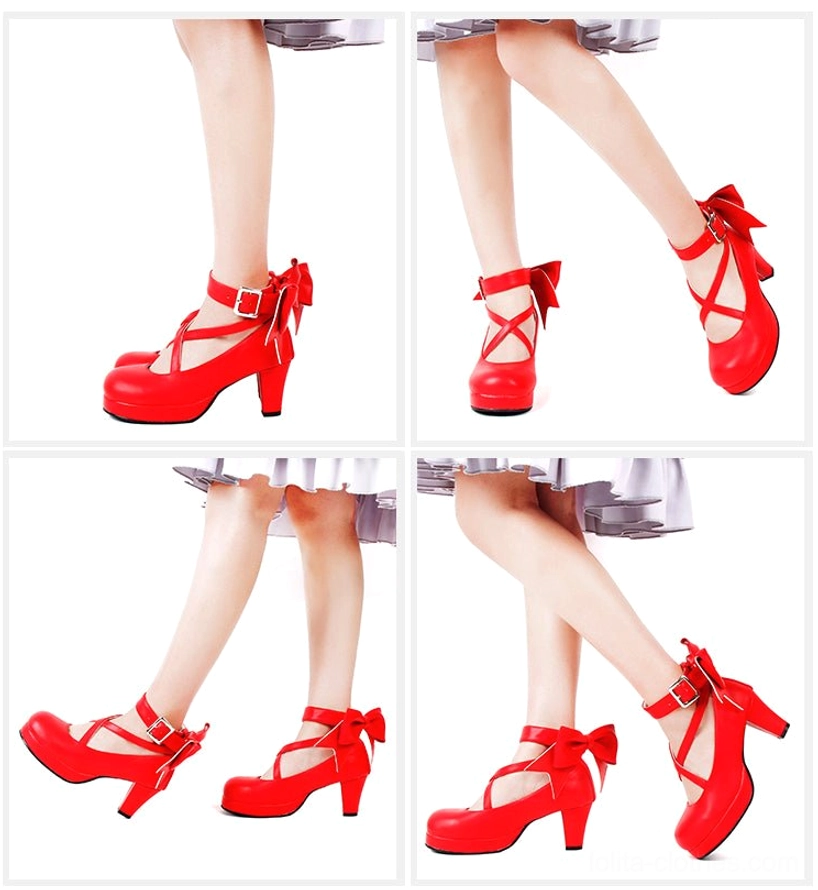 Red Lolita platform high heel shoes with glossy patent leather finish, crossover ankle buckle straps, large decorative back bow, round platform toe, and chunky block heel - professional display