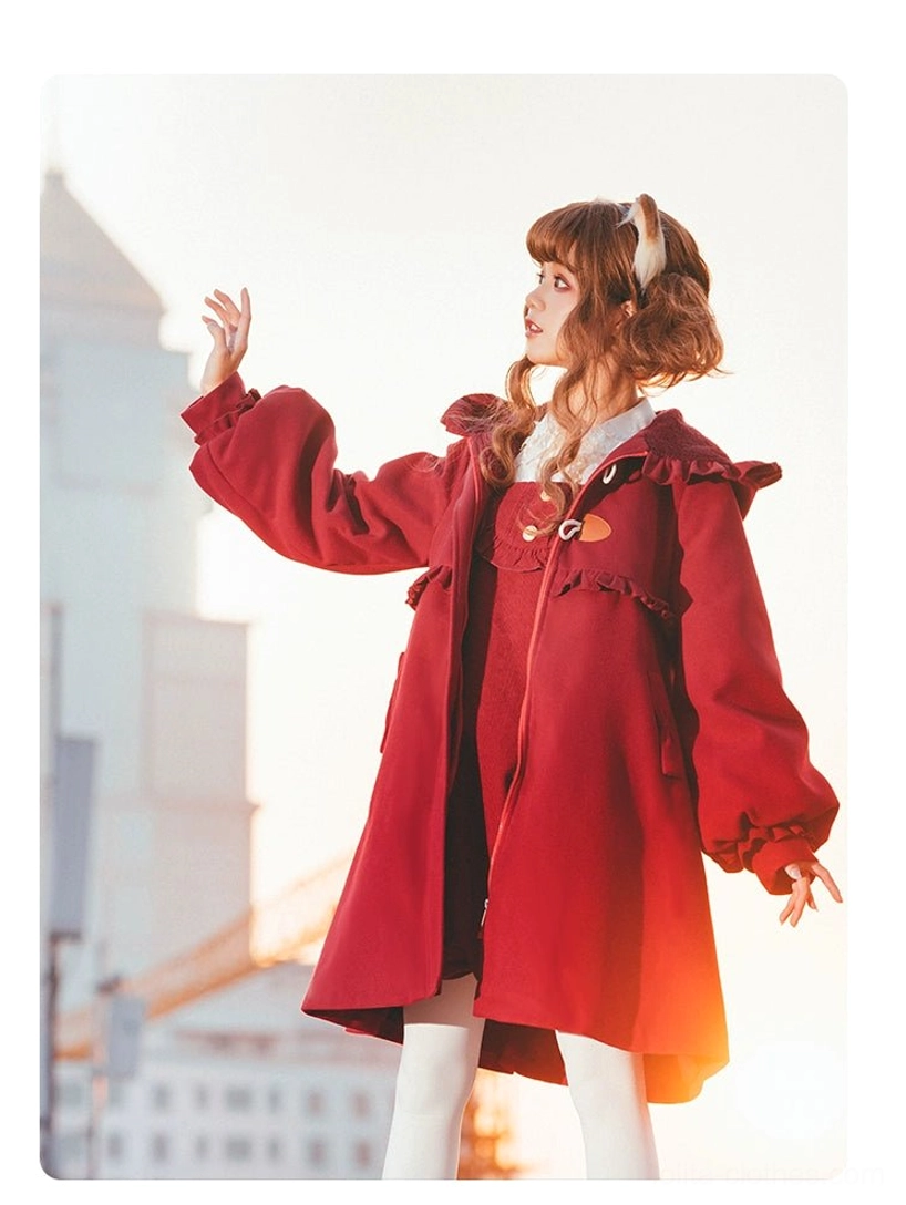 Red lolita woolen coat three quarter side standing shot urban building background ruffled shoulder trims front side pockets loose A-line fit