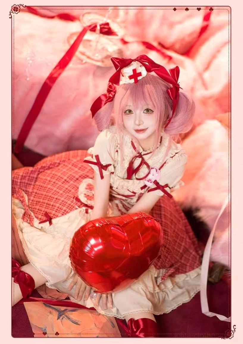 Detachable front waist bow accent from red plaid lolita cake JSK dress with red ribbon and bow embellishments, removable styling feature