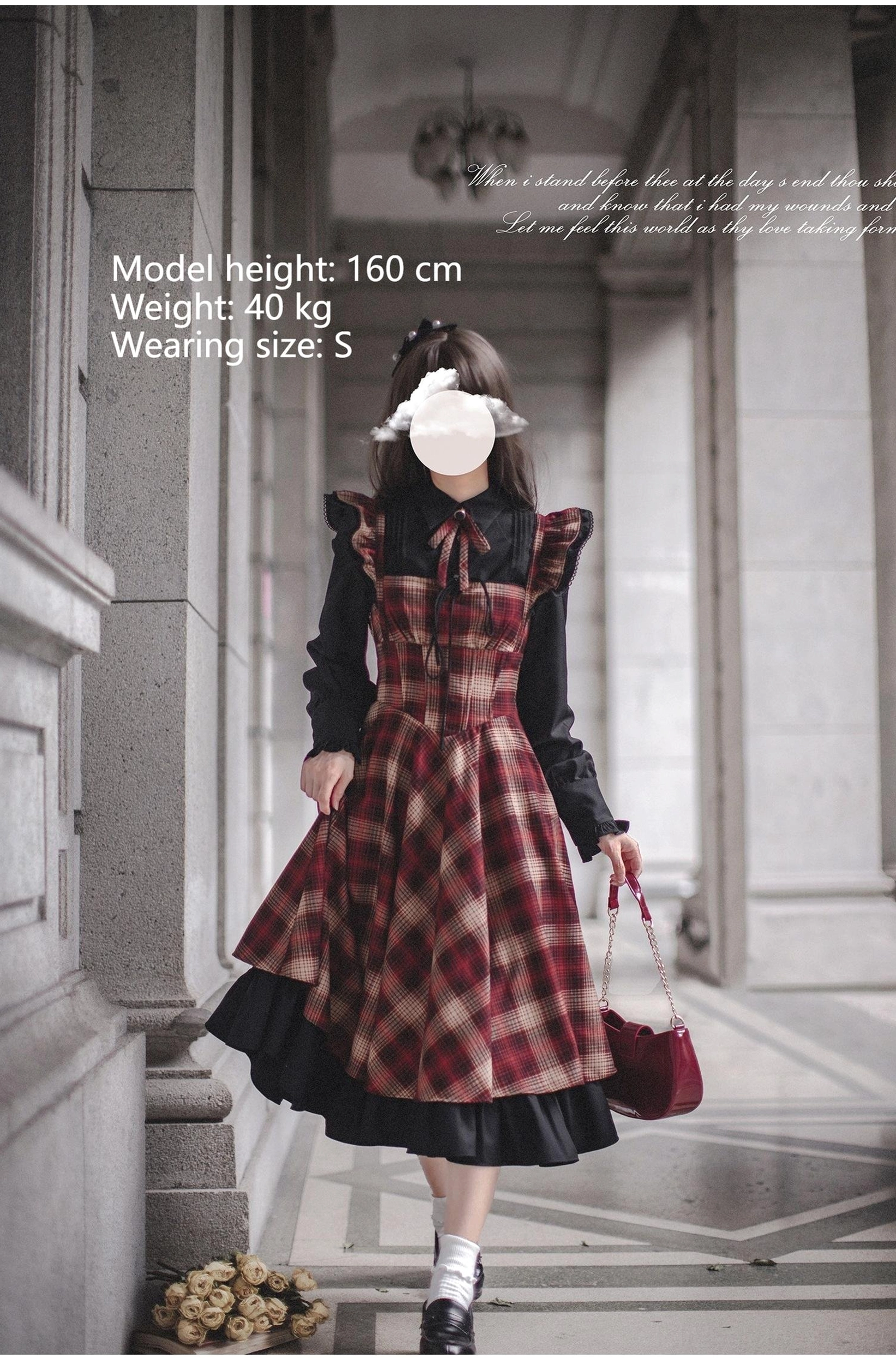 Red plaid classic lolita JSK showing full A-line silhouette with double-layer black ruffled hem and scalloped shoulder straps - front skirt-lifting view on European stone staircase