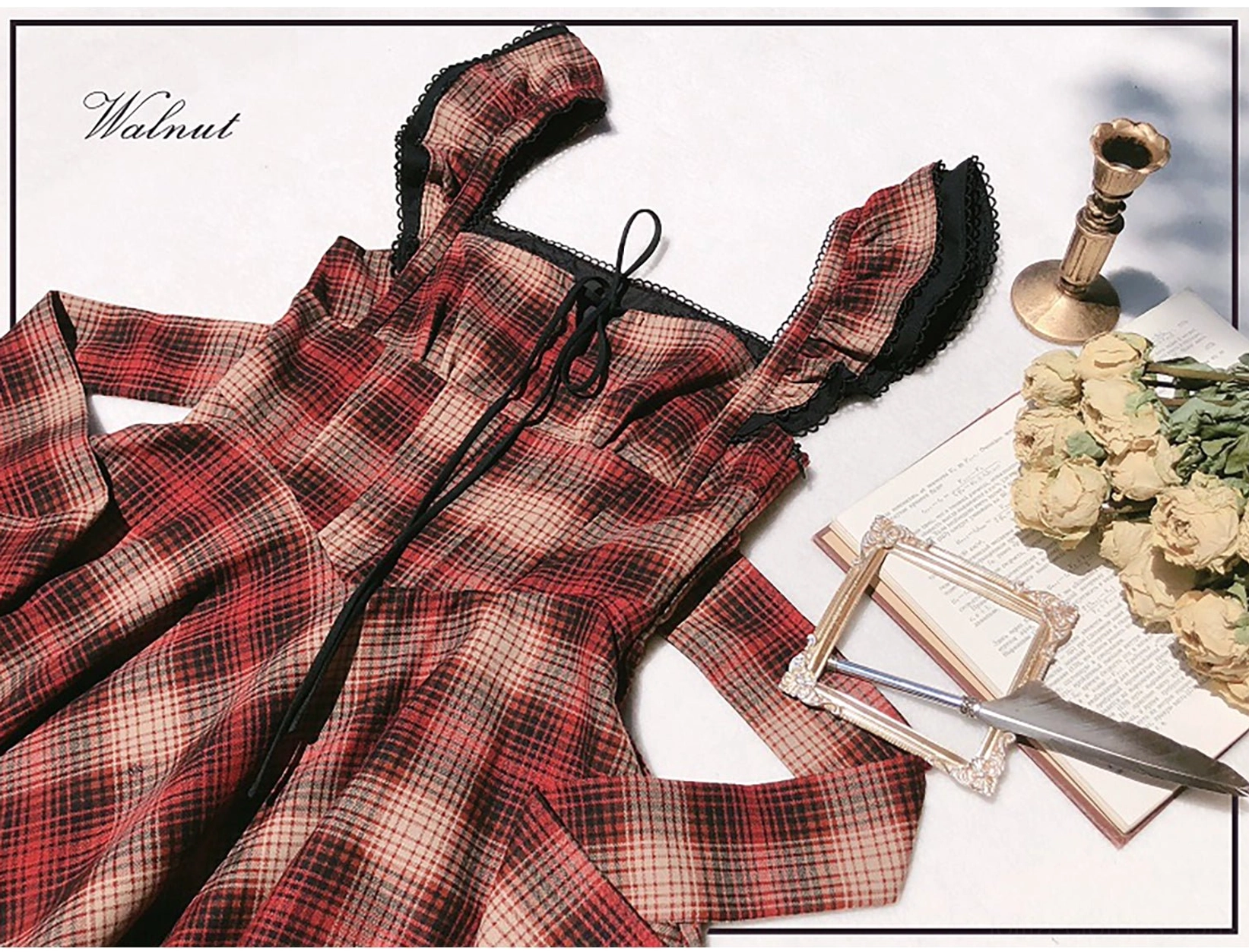 Red plaid lolita JSK jumper skirt close-up detail showing authentic tartan pattern, v-line waist construction, delicate ruffled shoulder straps with scalloped edging and ruffle trim