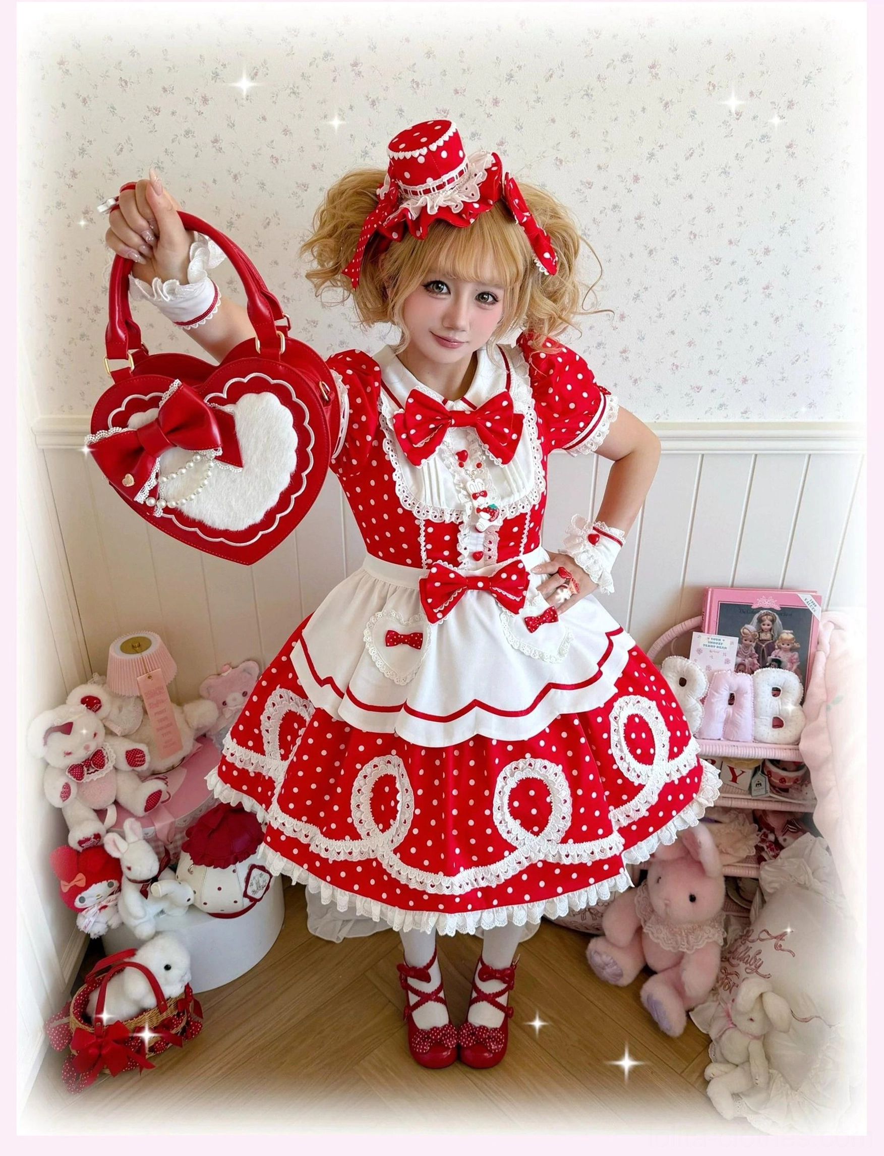 Front close-up of red polka dot lolita OP dress neckline bow and white lace trim detail