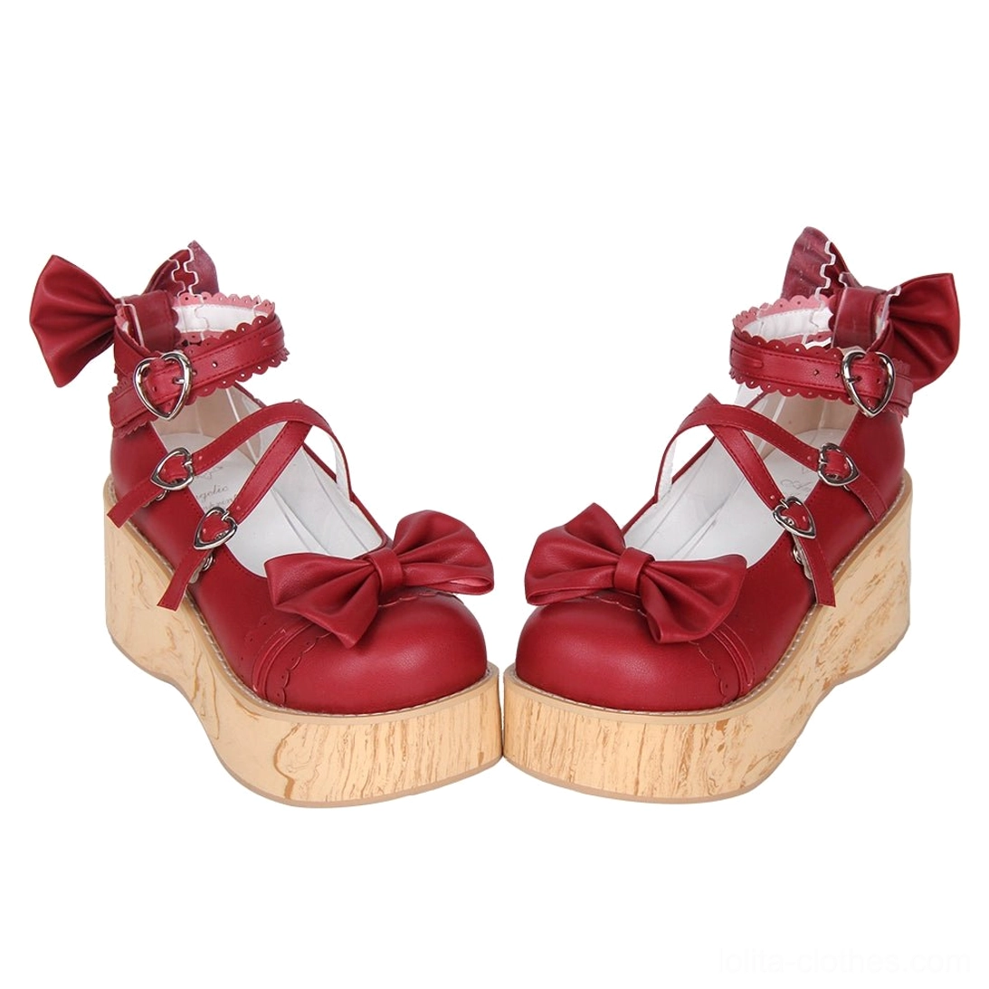 Red Princess Lolita platform shoes front three-quarter view displaying red leather vamp, decorative toe cap bow, double-cross ankle straps, and wood grain textured platform sole