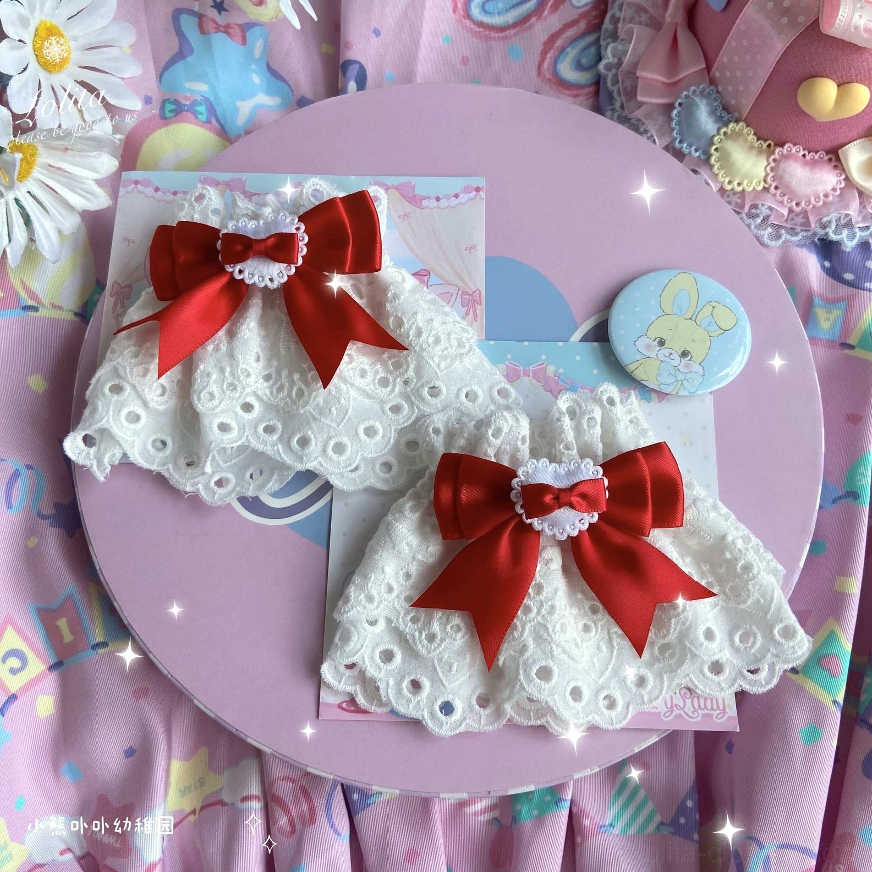 red satin bow lace wrist cuffs with central heart design white eyelet base styled with bunny prop