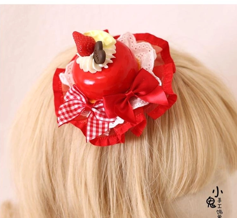 Red strawberry dessert Lolita hairpin back overhead view on mannequin wig highlighting top cake decoration and embellishment details of the headdress