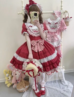 Red Strawberry themed Sweet Lolita one-piece dress showing back view with tiered ruffled skirt, detachable apron, and red gingham bow