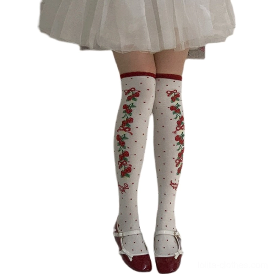 red sweet lolita knee-high cotton socks polka dots cherry bow prints red cuff trim white tulle skirt flat front view neutral background