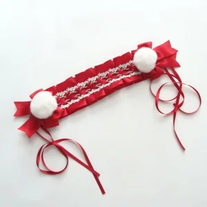 Red sweet Lolita lace headband with white pom-pom decorations and ruffled lace trim, displayed flat lay studio view