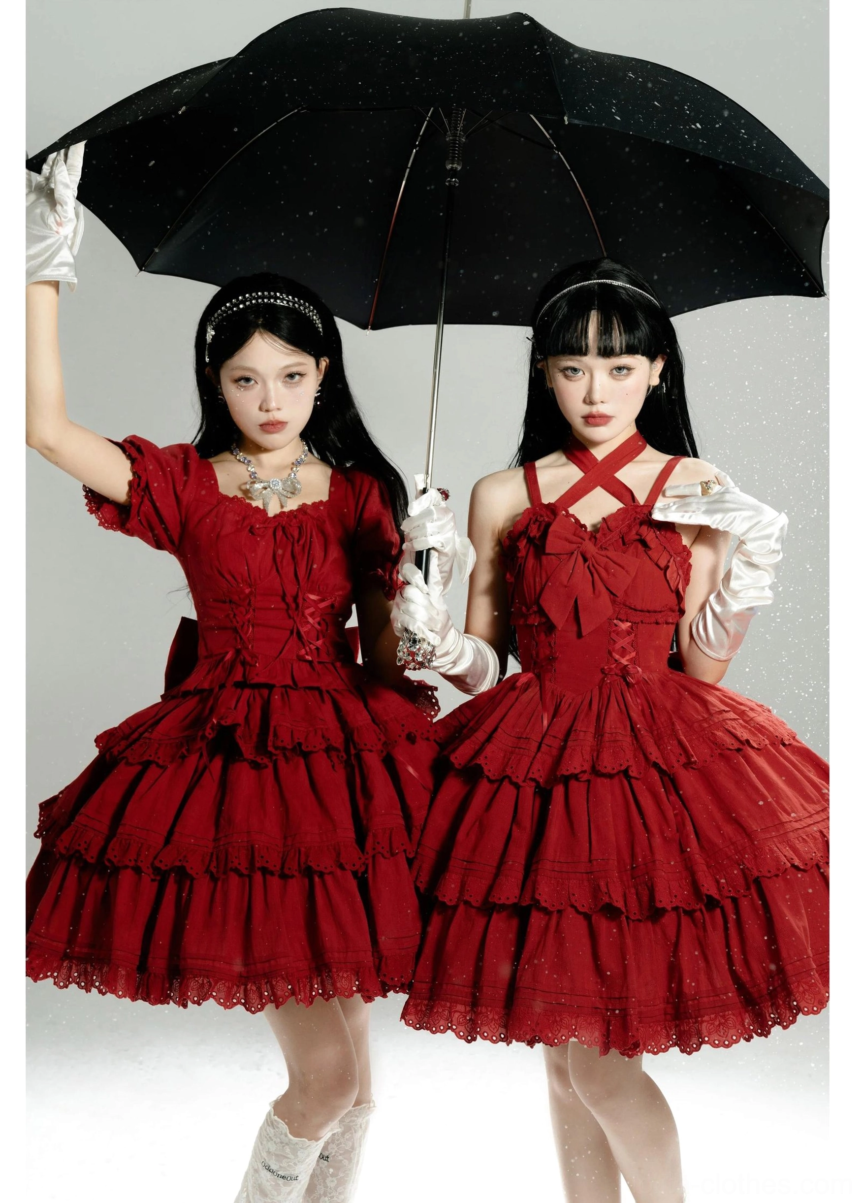 Red sweet lolita dress set with cross halter neckline, heart-shaped neck decoration, tiered ruffled hemline, large back bow, worn by two models holding umbrella with white gloves