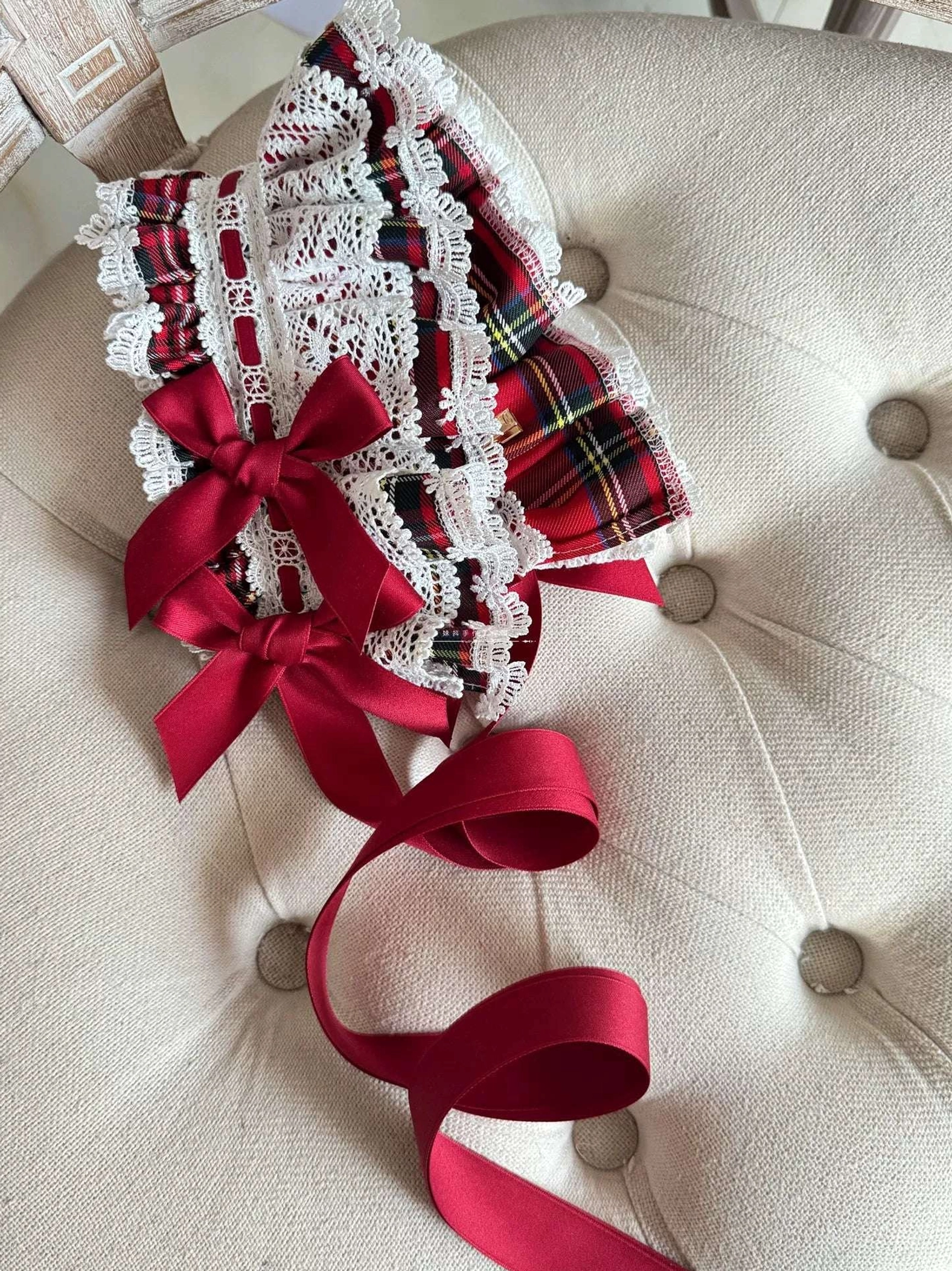 Red tartan Lolita BNT bunny ear bonnet styled on mannequin demonstrating how wire-edged ears can be positioned in standing configuration for youthful perky appearance