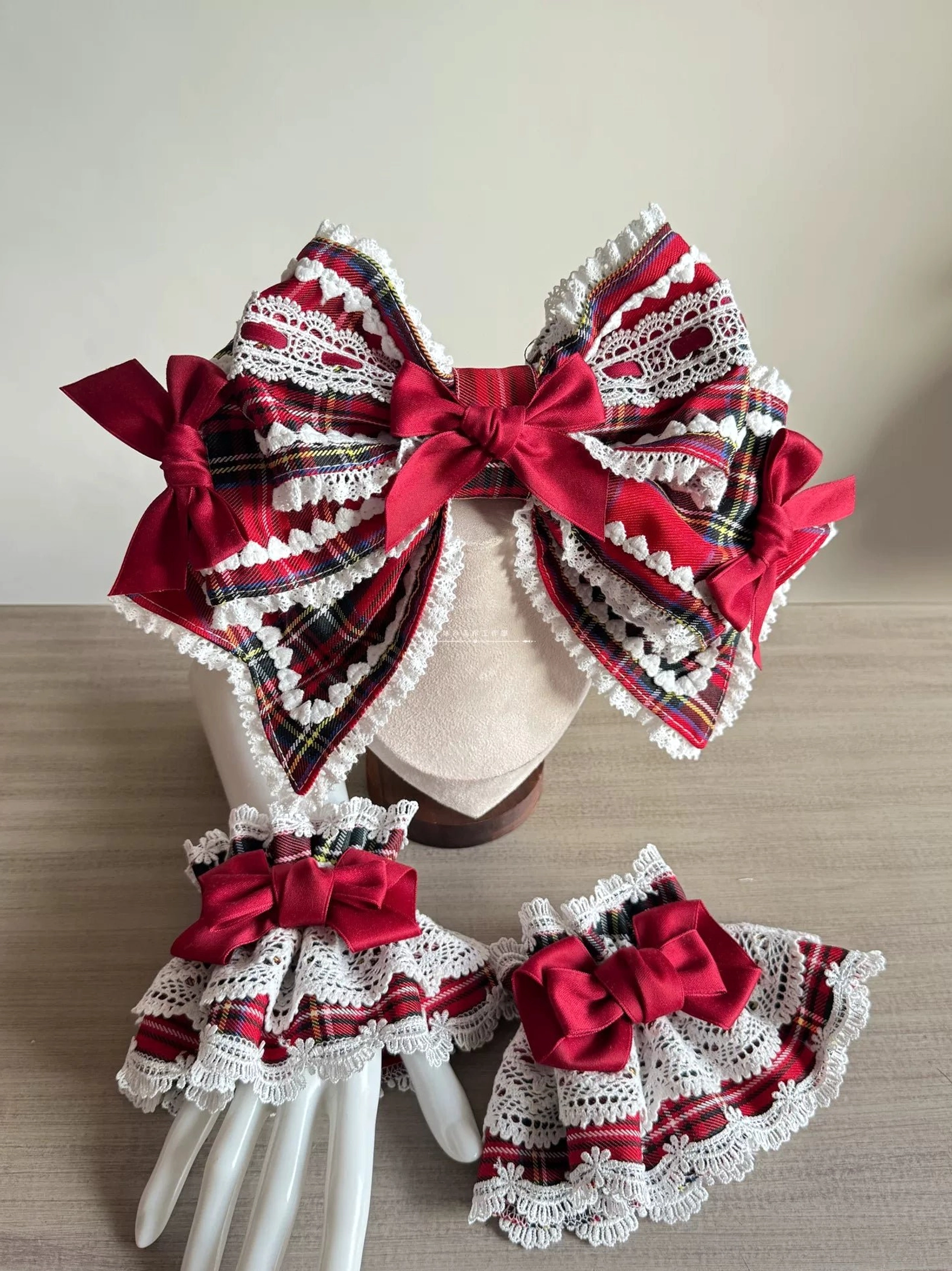 Red tartan Lolita complete headdress ensemble showing integration of multiple components including BNT bonnet, layered hair bow, headband option, and coordinated wrist cuffs together