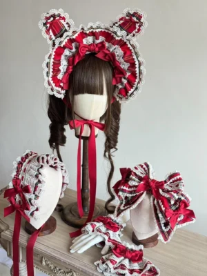 Complete red tartan Lolita headdress accessory set featuring wire-edged bunny ear BNT bonnet, layered hair bow with satin details, ruffled headband, and coordinated elastic cuffs displayed on light wooden surface with neutral background