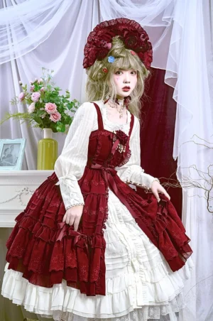 Red and white two-tone Lolita dress set with blouse and JSK full body front view, model wearing large flower formal hat, contrast layered ruffled hem with flower brooch decoration in vintage interior