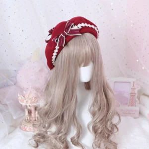 Red wine woolen lolita beret with white lace trim and plaid ribbon bow worn on blonde mannequin, three-quarter front view against dreamy pink carousel background