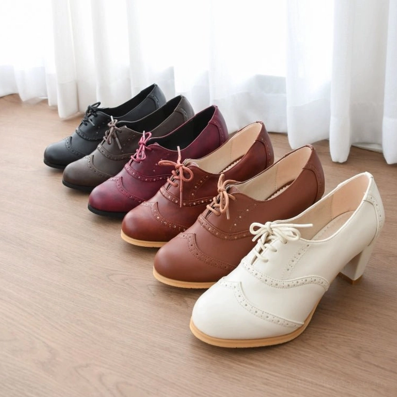 Retro lolita handmade heel shoes showing perforated leather design and hand-carved brogue details from overhead perspective