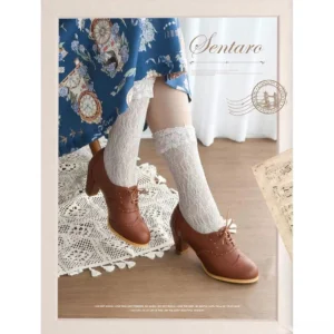 Retro lolita handmade perforated brogue Mary Jane heel shoes in mocha brown leather with lace-up closure, shown from front view with matching vintage floral dress and frilly socks
