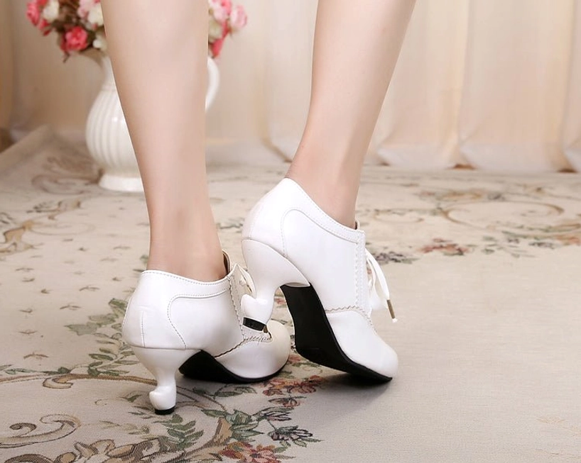 Retro Lolita Mary Jane high heel shoes in versatile neutral tone, featuring deep mouth silhouette, vintage ribbon lace-up closure, curved spool heel, and scalloped stitching details