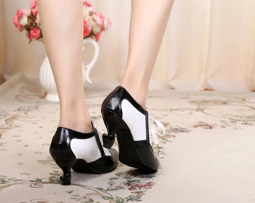 Retro Lolita Mary Jane high heel shoes with distinctive curved spool heel, scalloped edge detailing, and ribbon lace fastenings representing quintessential period-accurate design