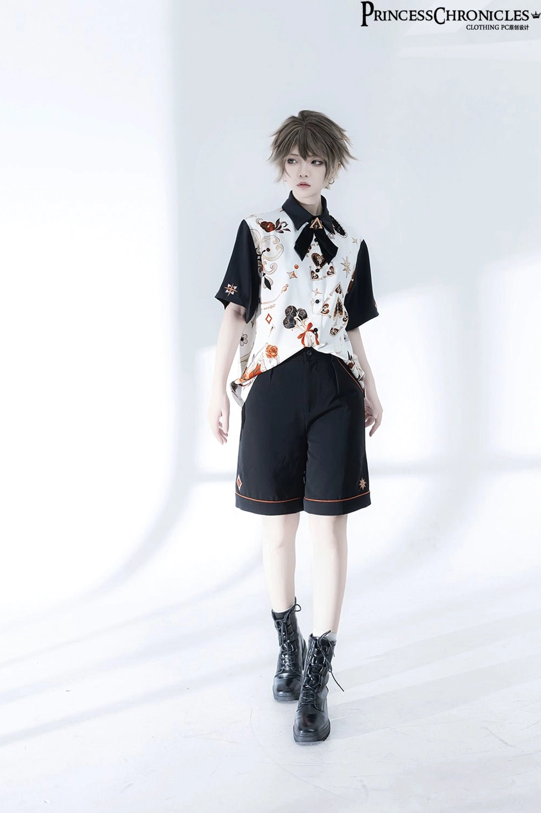 Complete retro Ouji Lolita suit full front standing view displaying overall proportions and silhouette, contrast color blocking, floral prints and structured black shorts