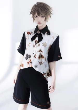 Retro Ouji Lolita floral short-sleeve shirt and black embroidered shorts two-piece set front three-quarter view, featuring contrast black sleeves, vintage print design, matching bow tie and orange-trimmed hem