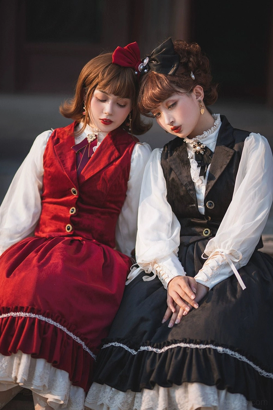 Two lolita models in retro velvet waistcoat matching set with wine red and black colorways, wearing stand-collar inner blouses and lace-trimmed skirts