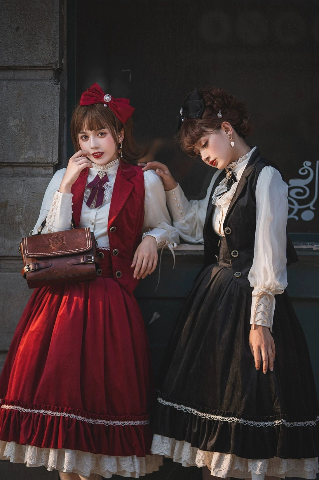 Retro velvet lolita waistcoat with ruffled cuffs and brown leather satchel, close-up of two models