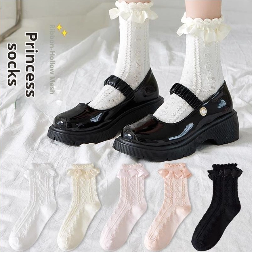 Ribbon hollow mesh Sweet Lolita mid-calf socks with twisted knit pattern and ruffled lace ankle cuff paired with black platform Mary Jane shoes flat lay display