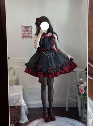 Black-red Gothic Lolita JSK dress worn by model in full-body mirror selfie with wine-red heels and black silk stockings showcasing red ruffled hem