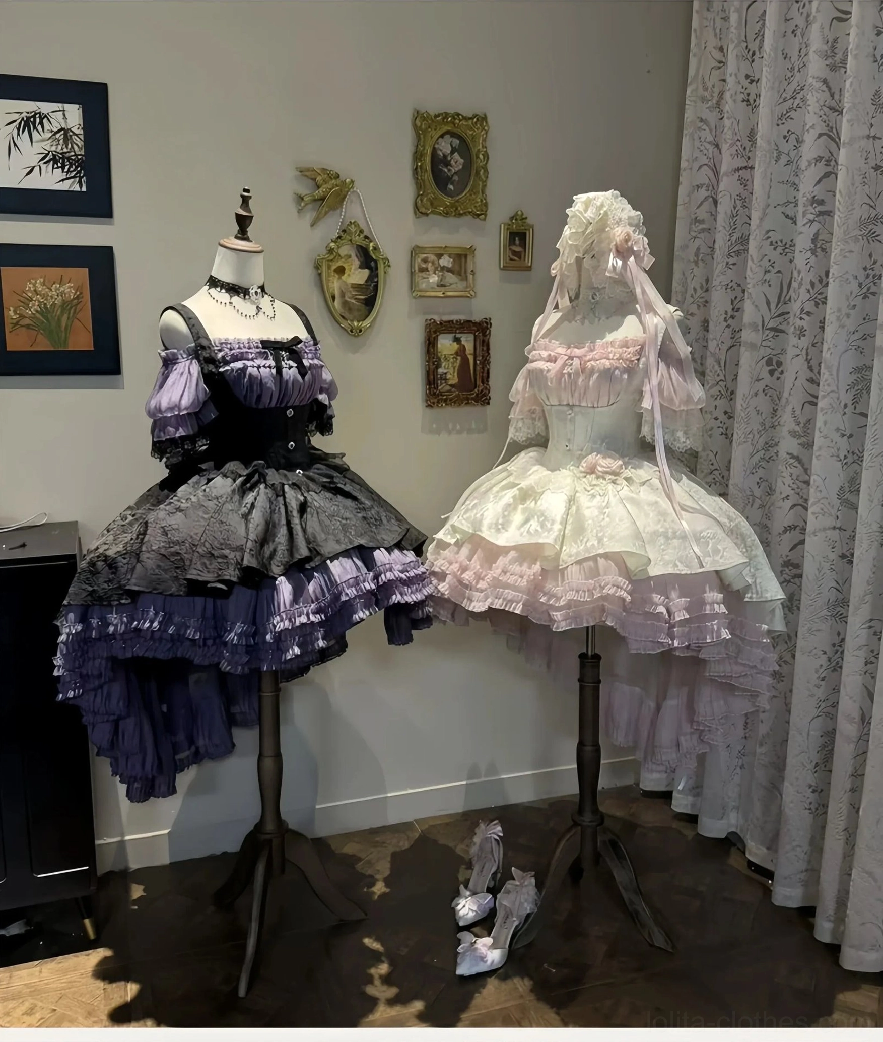 Gothic Lolita boned JSK dresses displayed on mannequins showing multi-layered high-low ruffled skirts with off-shoulder bodice in vintage exhibition gallery space