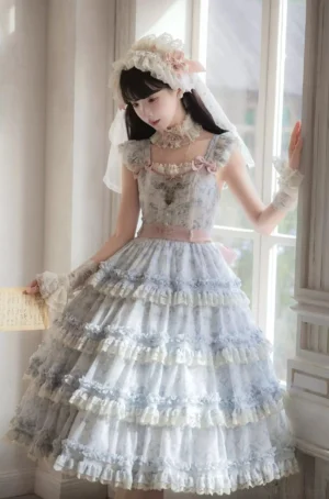 Sleeveless classic Lolita JSK jumper skirt with multi-layered ruffled hem, pink waist sash, lace neckline and rose print design detail