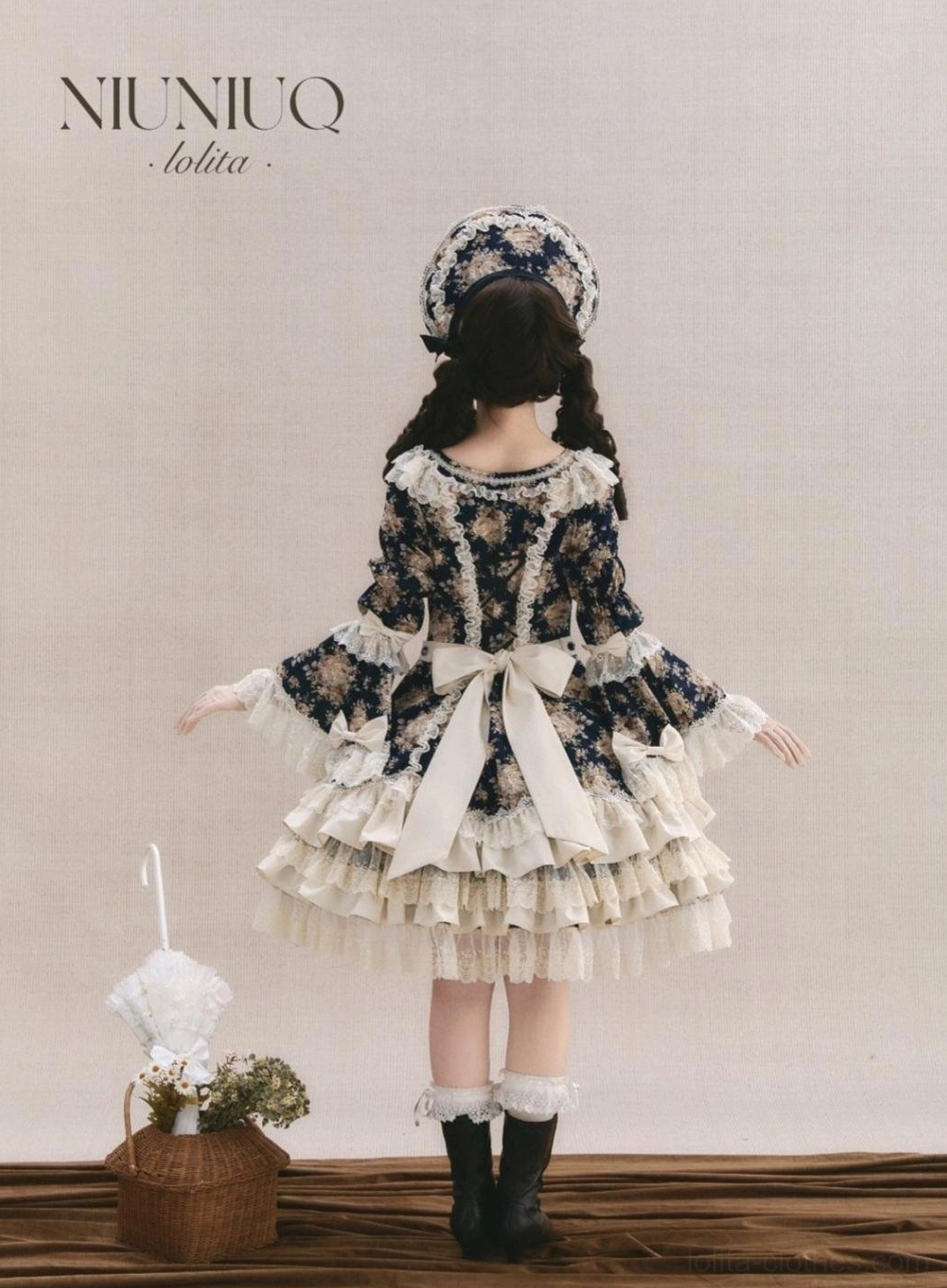 Old School Lolita OP dress back view with cream satin bow, tiered lace skirt, and matching hair bonnet