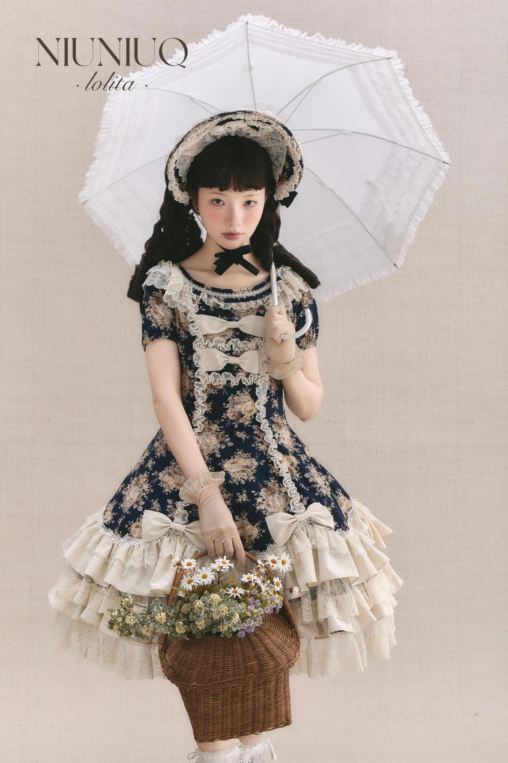 Short-sleeve vintage floral Lolita OP dress front view with matching bonnet, cream lace layered skirt, and white parasol