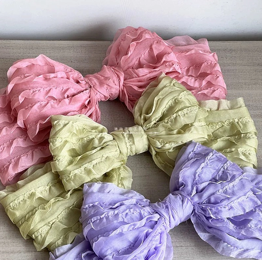 Rose pink beige and green ruffled organza lolita bow hair clips variety colors coordinated flat lay display