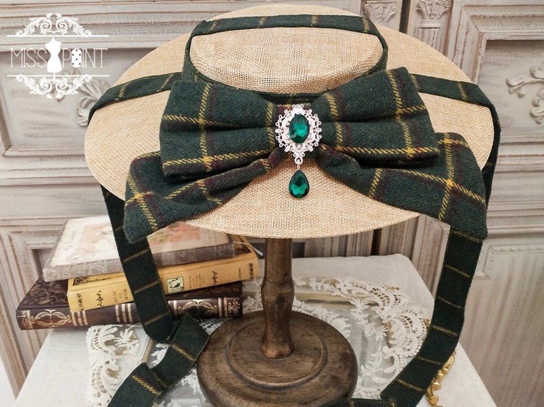 Rose silhouette lolita headdress with cameo and ruby gemstone accents, artistic angled view displaying the refined craftsmanship and vintage inspiration